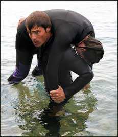 SCUBA instructor saving a person from drowning