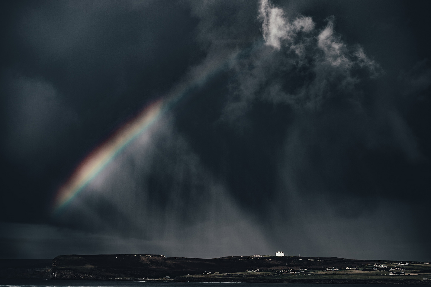 dark rain, with rainbow. There's hope!